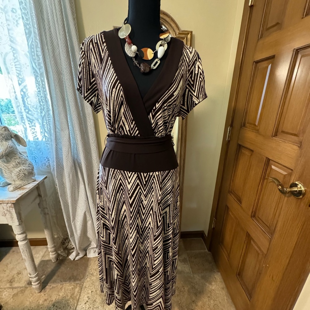 Medium weight polyester dress with self belt.
